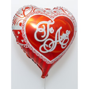 May include: Red heart-shaped balloon with white lace trim and the words "Te Amo" in white lettering.