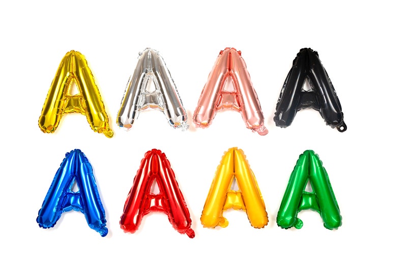 May include: A set of eight foil letter balloons, each in a different color, spelling out the letter "A". The colors are gold, silver, rose gold, black, blue, red, yellow, and green.
