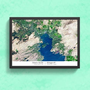 May include: A framed satellite image of Glengarrif, County Cork, Ireland and  Gleann Garbh, Connemara, Ireland. The image shows the coastline, water, and surrounding land.