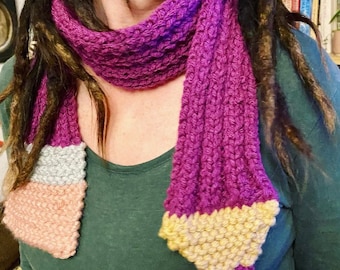 Knitted coloured pencil scarf