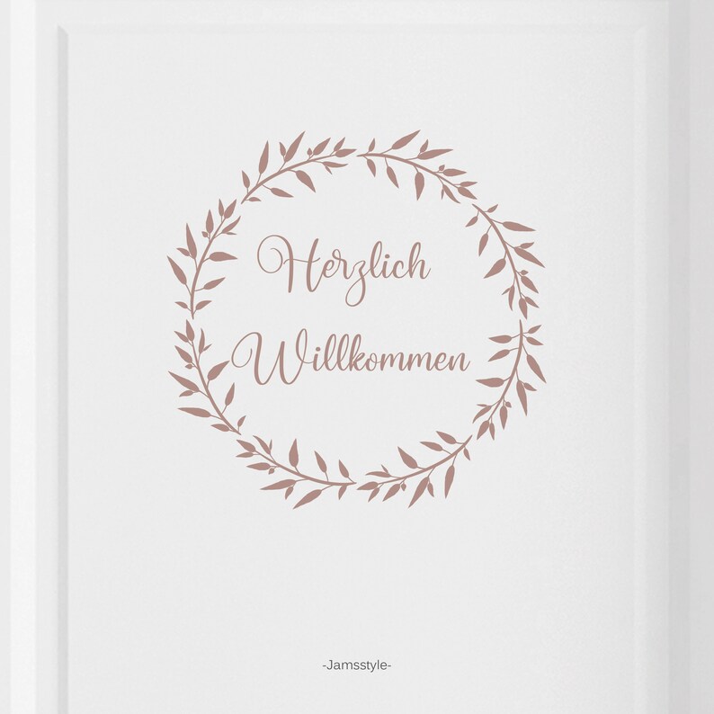 May include: A white background with a brown floral wreath that says "Herzlich Willkommen" in the centre. The text is in a cursive font. The bottom of the image says "Jamstyle".