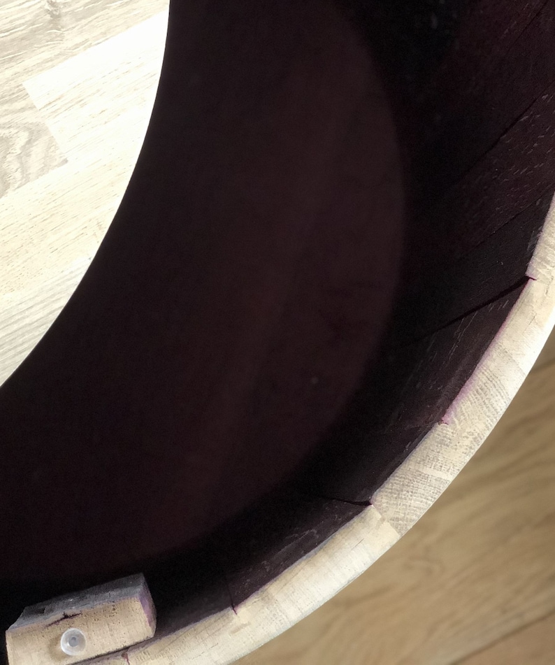 May include: A wooden barrel with a removable lid. The inside of the barrel is stained a dark purple color.