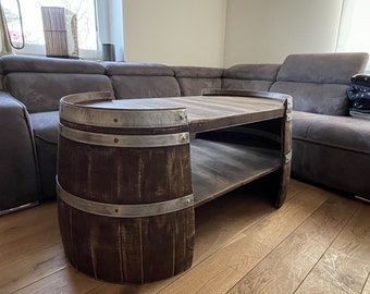 Long coffee table made from wine barrel halves in a whiskey barrel look