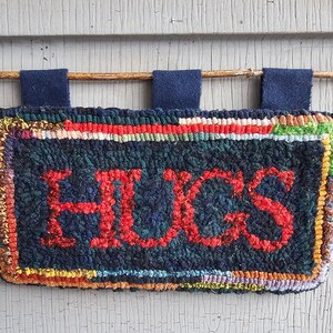 HUGS, Hooked Wool Mat or Wall Hanging