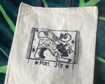 lion of joy tote bag