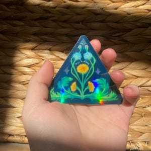 Pegatina triangular holográfica de diente de león