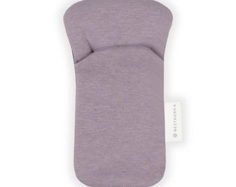 May include: A lavender-colored fabric eye mask with a small white label that says "BEZTROSKA".