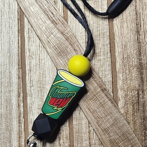 May include: A black lanyard with a black and green Mountain Dew cup charm, a black bead, and a yellow bead. The lanyard has a silver clip.