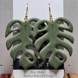 Monstera leaf clay earrings.