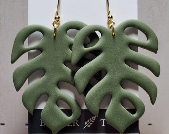 Monstera leaf clay earrings.