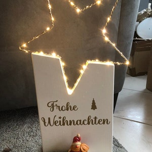 Small Christmas tele with an illuminated star