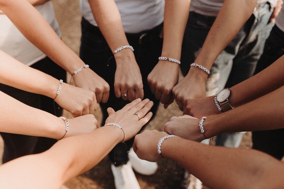 Group of friends friendship bracelets hi-res stock photography and images -  Alamy