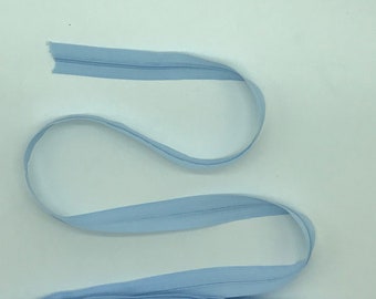 Light blue zipper with three zippers