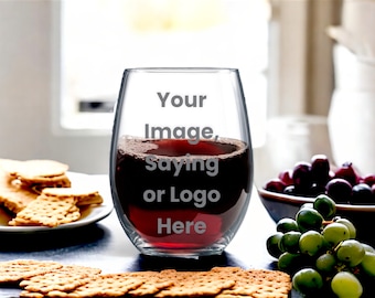May include: A clear glass wine glass with a stem, filled with red wine. The glass has the text "Your Image, Saying or Logo Here" etched on the side.