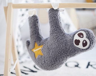 Cuddly toy sloth with nametrain