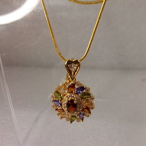 Two strand necklace of 925 gold chain with pendant of gemstones