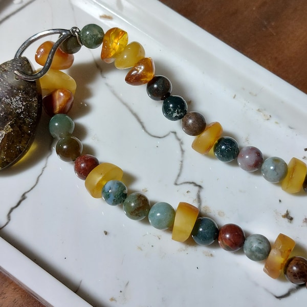 Necklace of jasper and Baltic amber. Pendant is large piece of Baltic amber