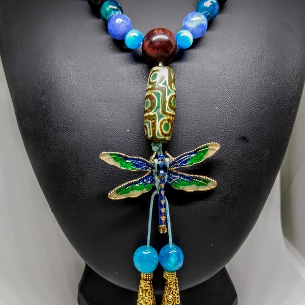 Mala Style Necklace featuring faceted Dragon Vein beads, cat's eye beads, a Dzi Bead, and a Dragon Fly. Tied with Satin Macrame Cord.