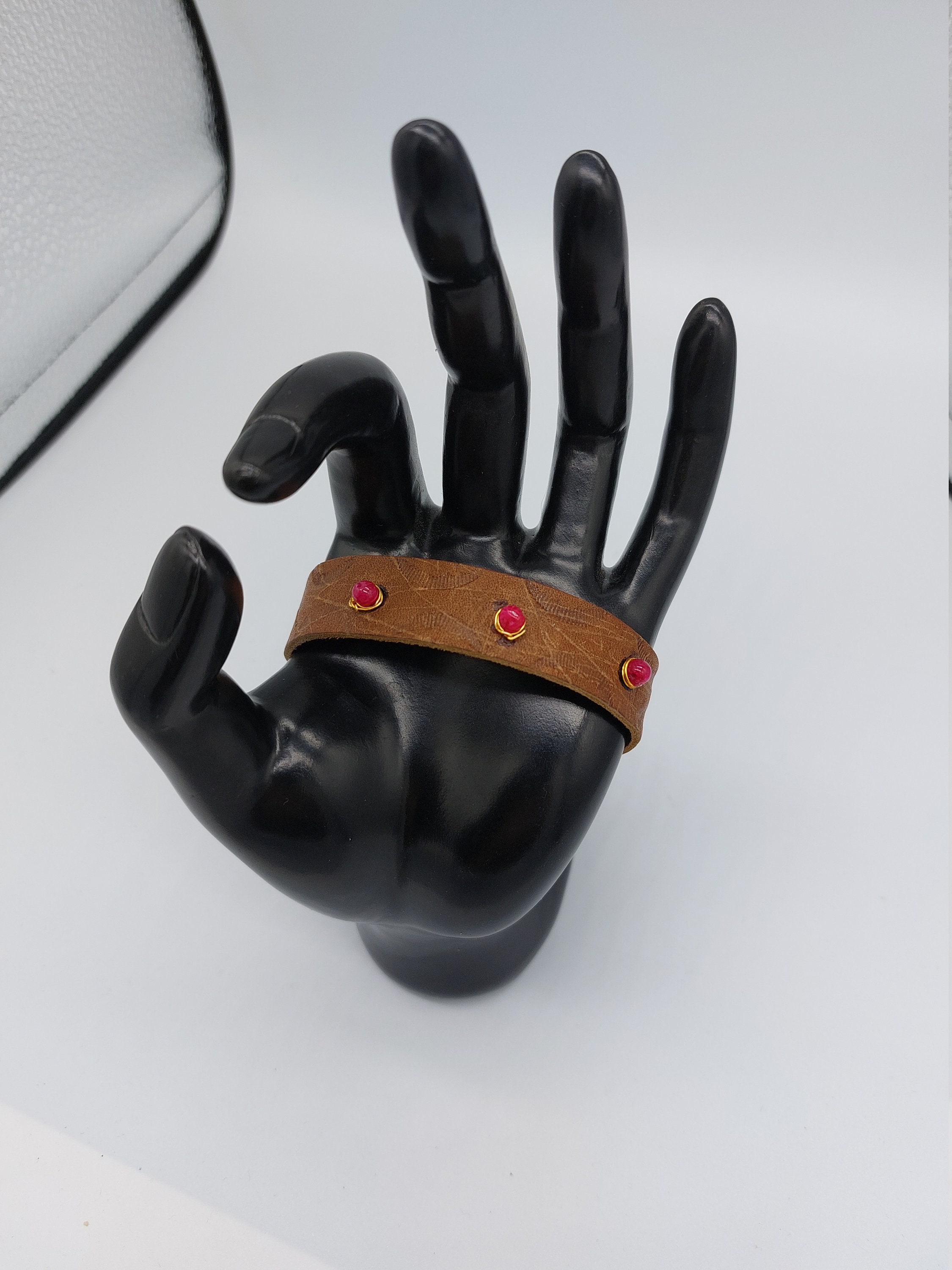 Leather watchband style bracelet with wire wrapped ruby beads