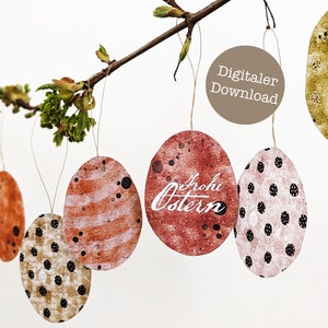 Puede incluir: Un conjunto de cinco diseños de huevos de Pascua imprimibles. Los huevos están decorados con diferentes patrones, incluyendo lunares, rayas y un efecto acuarela. Un huevo tiene el texto "Frohe Ostern" escrito en él. El texto "Digitaler Download" está escrito en un círculo marrón.