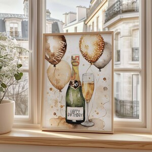May include: A watercolor painting of a champagne bottle and glass with balloons. The bottle has a label that says "Happy Birthday". The balloons are brown, gold, and white with gold polka dots. The painting has a brown background with gold and white splatters.