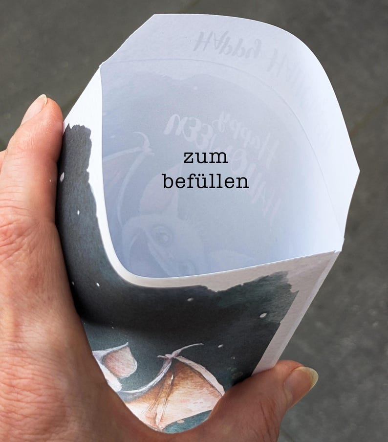 May include: A white paper cone with the text "zum bef&uuml;llen" printed on it. The cone is decorated with a watercolor illustration of a bat flying in a starry night sky.