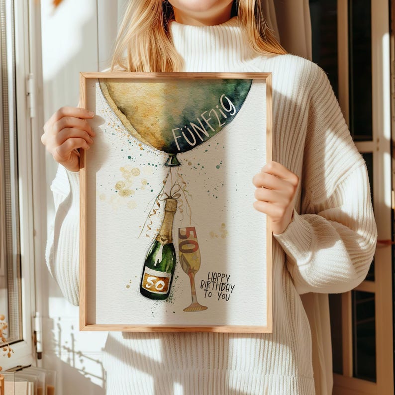 Peut inclure: Une illustration aquarelle d'un ballon vert et or avec le mot "F&Uuml;NFZIG" &eacute;crit dessus. Une bouteille de champagne et une coupe de champagne sont attach&eacute;es au ballon avec un ruban. Le texte "Happy Birthday to You" est &eacute;crit sous le ballon.