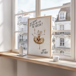May include: A watercolor illustration of a mouse wearing a tutu and holding two glasses of champagne. The text "Mit Balance im Leben und Liebe im Herzen!" is written above the mouse. The text "Happy Birthday" is written below the mouse.