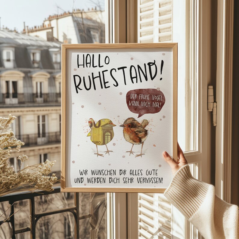 May include: A framed print with a watercolor illustration of two birds. The text reads "Hallo Ruhestand! Der fr&uuml;he Vogel kann mich mal! Wir w&uuml;nschen dir alles gute und werden dich sehr vermissen!"