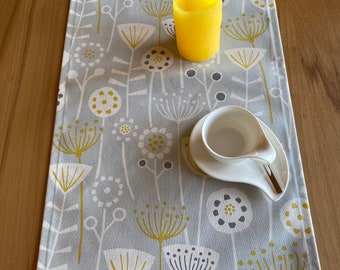 Pale gray table runner, dandelions, Scandinavian style,