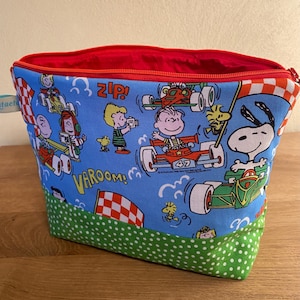 Bolsa de cosméticos Peanuts, Corrida com Snoopy e família