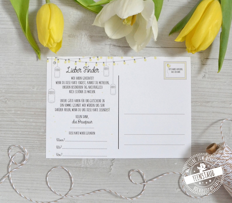 May include: A white postcard with text in German, featuring a string of yellow lights and jar illustrations. The postcard includes fill-in-the-blank sections and a stamp-like design. Yellow and white tulips are in the background.