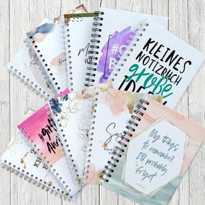 Notizbücher in verschiedenen Designs, personalisierbar mit Namen und Spruch