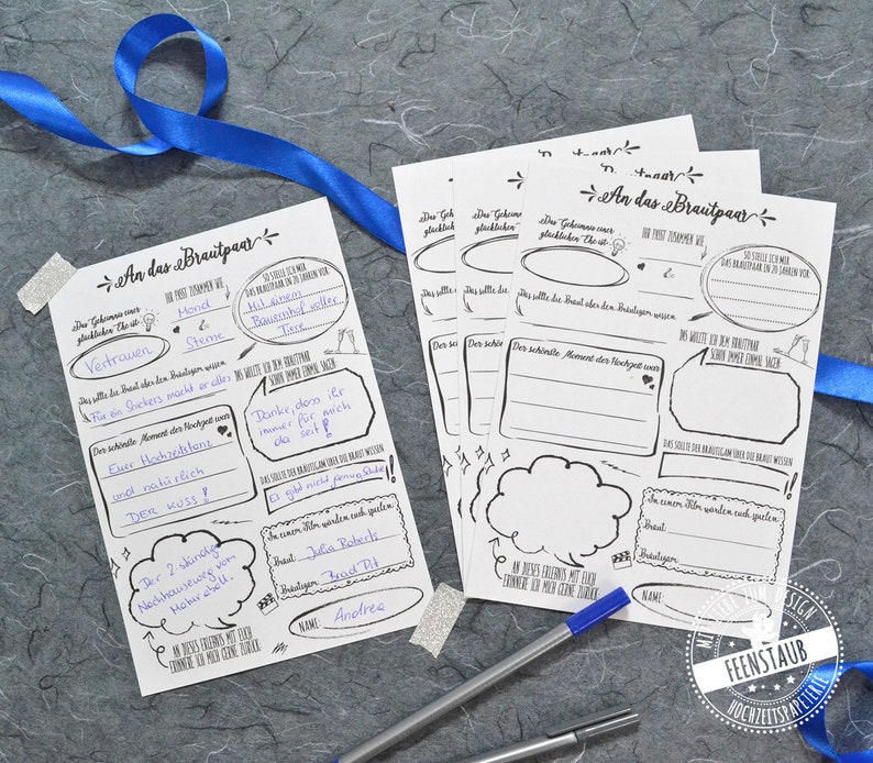 May include: Two blank printable cards with a black and white design for a wedding or bridal shower. The cards have prompts for guests to write messages to the couple. The text on the cards reads "An das Brautpaar" which translates to "To the Bridal Couple".