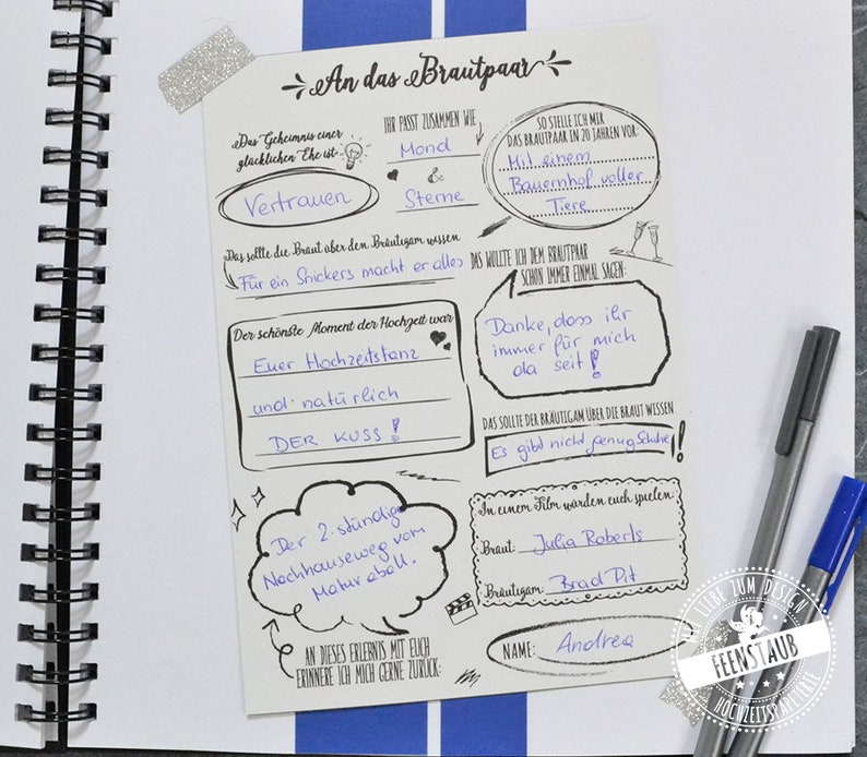 May include: A white card with black text and drawings. The card is a wedding guest book with prompts for the guests to write about the couple. The text includes "An das Brautpaar", "Vertrauen", "Der sch&ouml;nste Moment der Hochzeit war", "Euer Hochzeitstanz", "und nat&uuml;rlich DER KUSS!" and "Danke, dass ihr immer f&uuml;r mich da seit!"
