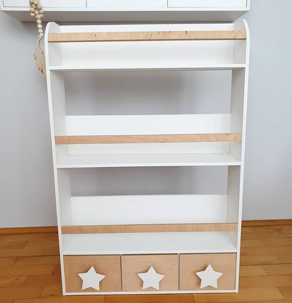 white wooden childrens bookcase