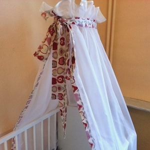 Delicate bed canopy with desired border and bow from Atelier MiaMia