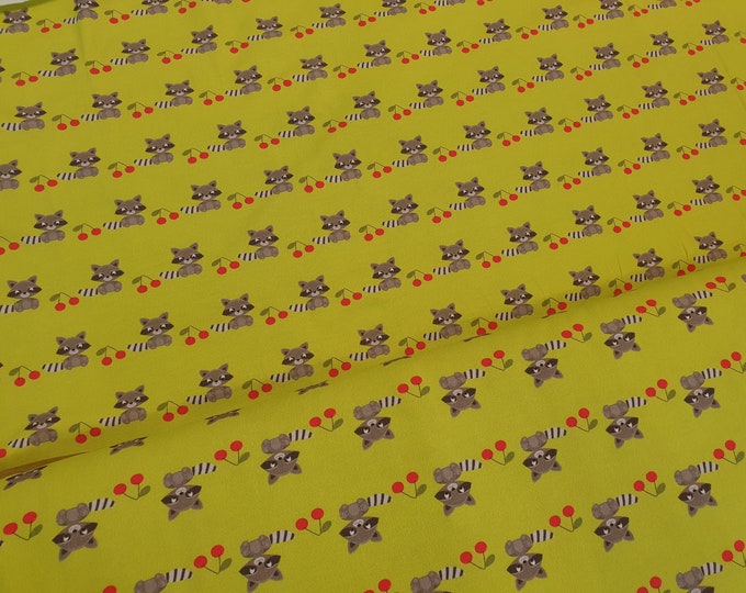 Cotton jersey raccoons green 13 EUR/meter from Atelier MiaMia