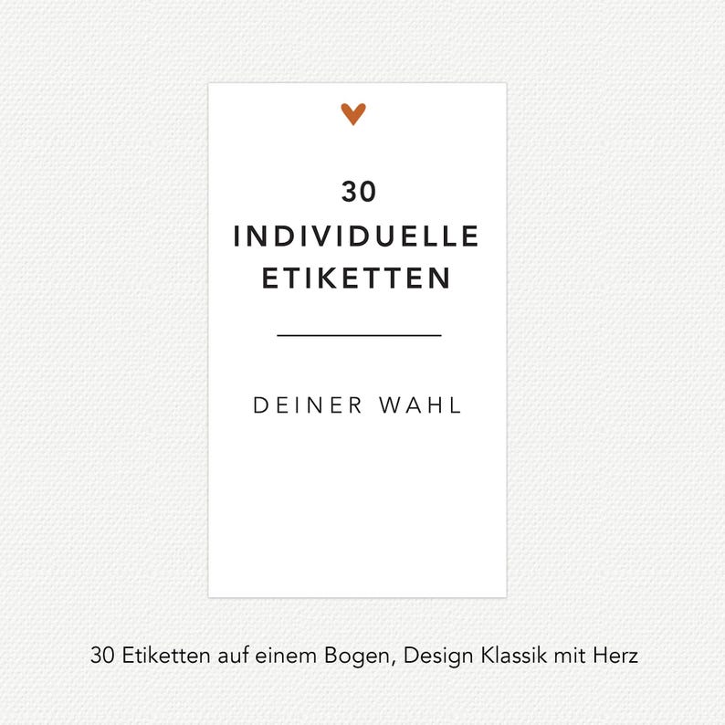 May include: A white card with the text "30 INDIVIDUELLE ETIKETTEN" and "DEINER WAHL" in black. A small brown heart is at the top. The card is on a textured white background.