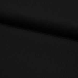 Könnte beinhalten: Schwarzer Stoff mit einer glatten, gleichmäßigen Textur. Der Stoff ist in der Mitte gefaltet und bildet eine weiche Kurve.