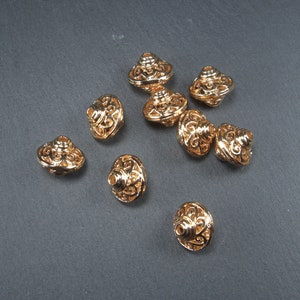 2 filigree beads, floral pattern, UFO-shaped, 24 K gold-plated, 10602