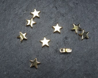 2 petits pendentifs étoiles, or, 10386