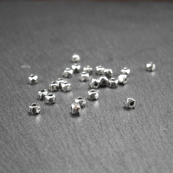 20 small hexagonal spacer beads, 10869