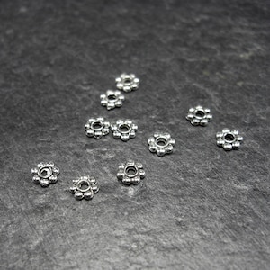 20 spacer beads, flowers, silver-colored, 10223