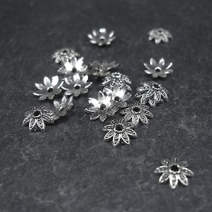 20 bead caps, flowers, 7 mm, antique silver-colored, 10196