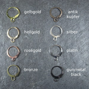 May include: Eight earring hooks in different metal finishes: yellow gold, light gold, rose gold, bronze, antique copper, silver, platinum, and gunmetal black.