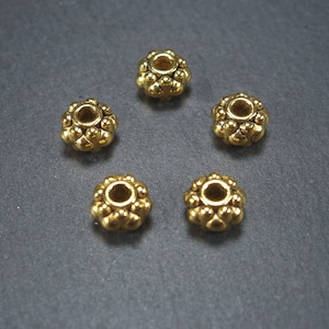 10 spacer beads 7 mm, flowers, gold-colored, 10465