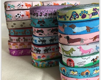 May include: A collection of colorful ribbon rolls with various animal and other designs. The ribbons feature cats, dogs, reindeer, and other animals. The ribbons are perfect for crafting, gift wrapping, and decorating.