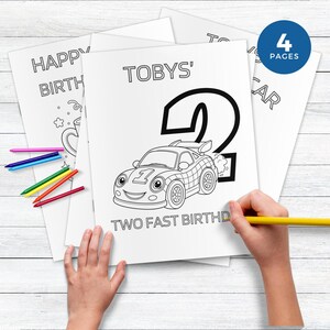 May include: A stack of white coloring pages with black outlines. The central page features a race car and the text "TOBYS' 2 TWO FAST BIRTHDAY". A blue circle indicates "4 PAGES". Colored pencils are scattered around the pages.