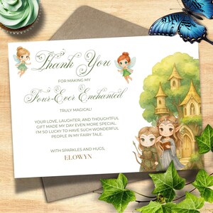 May include: A thank you card with the text "Thank You" and "Four-Ever Enchanted". The card features illustrations of fairies, a castle, and a butterfly. The card is on a brown envelope with green ivy.